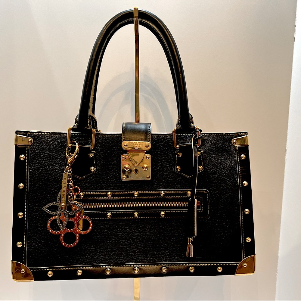 Louis Vuitton Suhal Black Leather bag with beautiful gold hardware.